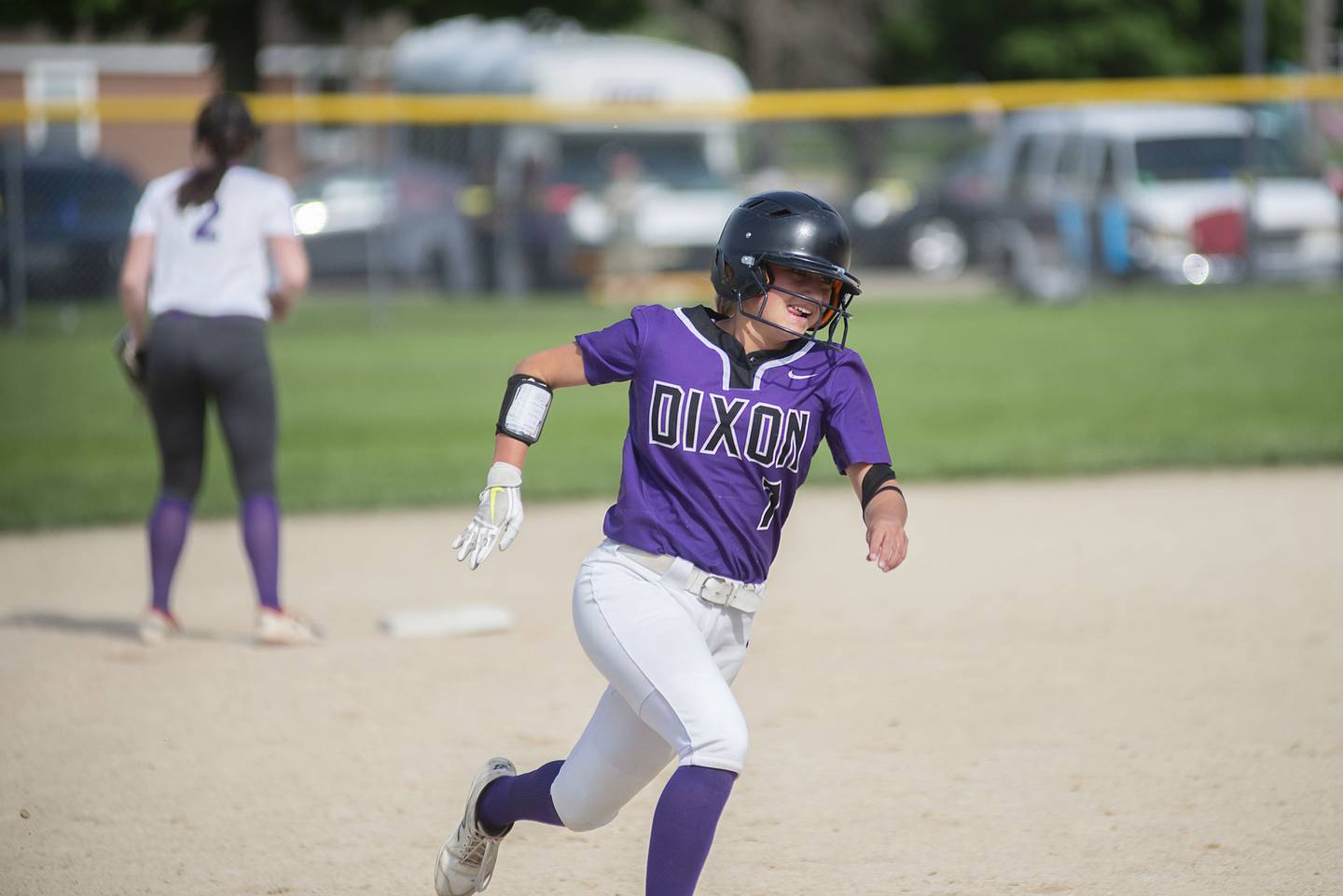 Dixon's Bailey Tegler scores on a triple by Sam Tourtillott against Rochelle Tuesday, May 24, 2022.