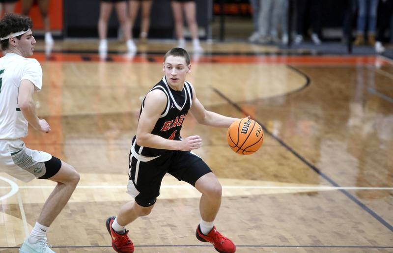 Glenbard East's Michael Nee drives toward the basket during a Class 4A St. Charles East Sectional semifinal against Glenbard West on Tuesday, March 4, 2025 in St. Charles.