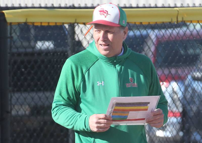 L-P softball head coach Randy Huebe coaches his team while playing Princeton on Tuesday, March 25, 2025 at the L-P Athletic Complex in La Salle.