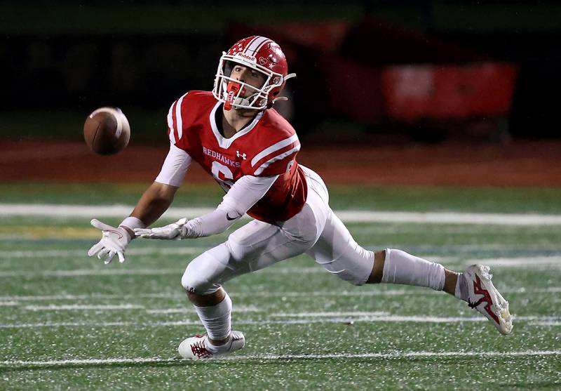 Naperville Central's Christopher Bern almost pulls in a long pass Friday October 27, 2023 in Naperville.