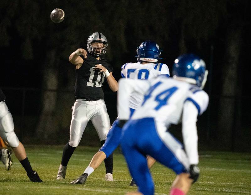Kaneland’s Troyer Carlson (10) throws a pass against Riverside Brookfield during a 6A playoff football game at Kaneland High School in Maple Park on Friday, Oct 28, 2022.