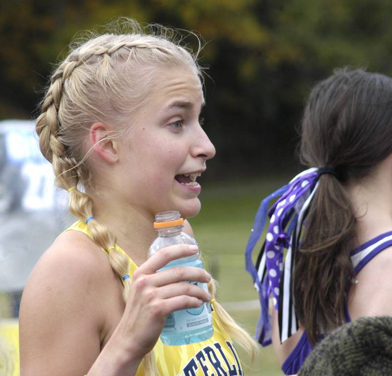 Sterling's Lacey Updike  talks to friends about the race. Sterling hosted their Cross Country final at Hoover Park on Saturday, October 25, 2025.
