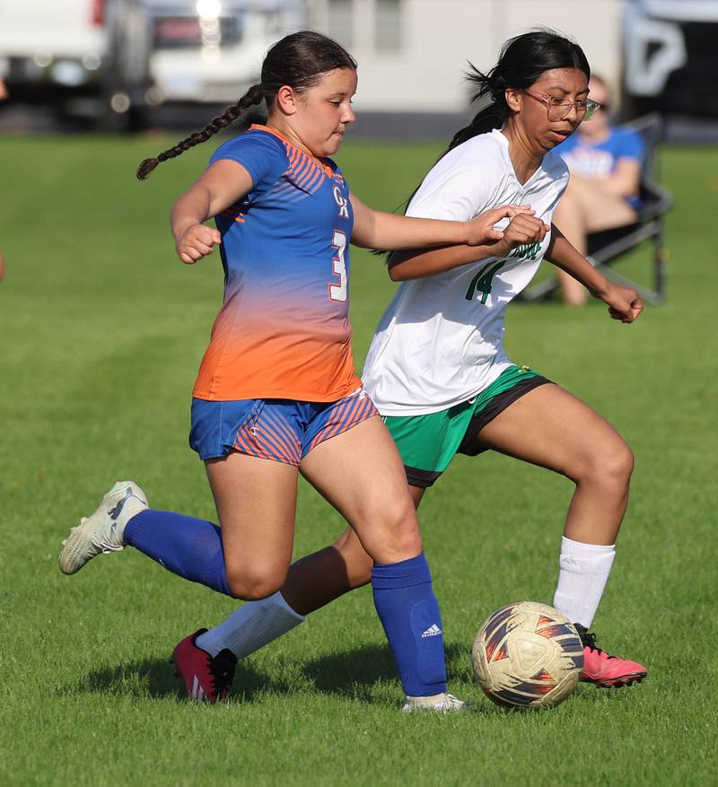 Genoa-Kingston's Ayva Hernandez pushes the ball past an opponent Thursday, April 23, 2026, during their game against North Boone at Genoa-Kingston High School.