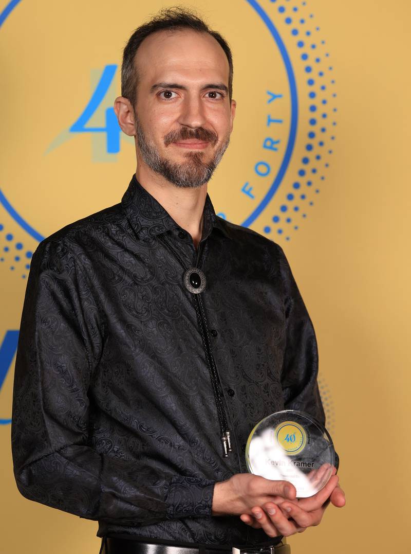 Kevin Kramer poses with his 40 Under Forty award during the Illinois Valley Chamber of Commerce Champions of Change Awards Night on Thursday, April 10, 2025 at the Westclox Event Center in Peru.