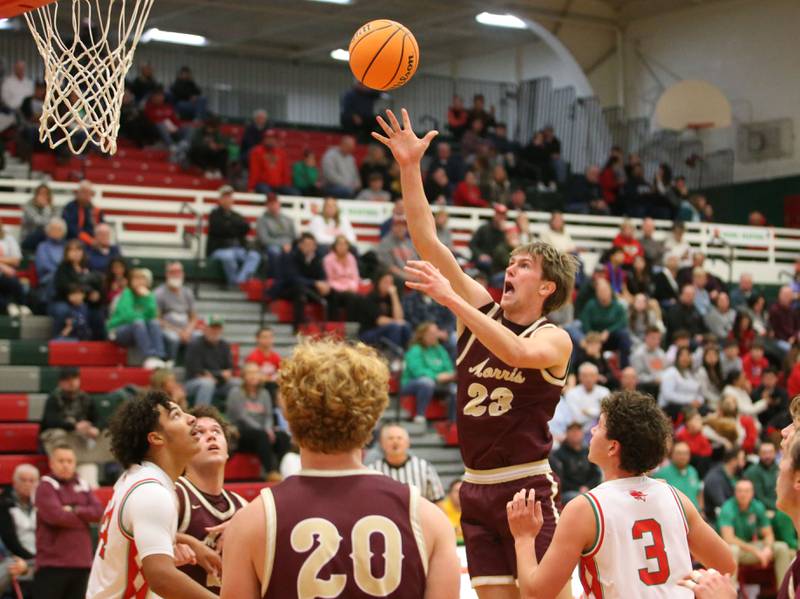 Morris's Jack Wheeler lets go of a shot in the lane as L-P's Marion Persich and Mikey Hartman defend on Friday, Dec. 6, 2024 in Sellett Gymnasium at L-P High School.