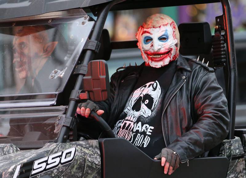 A character from the Nightmare on Fairgrounds Road Haunted Attraction rides in a UTV during the 5th annual Halloween Parade on Saturday, Oct. 28, 2023 downtown Princeton.
