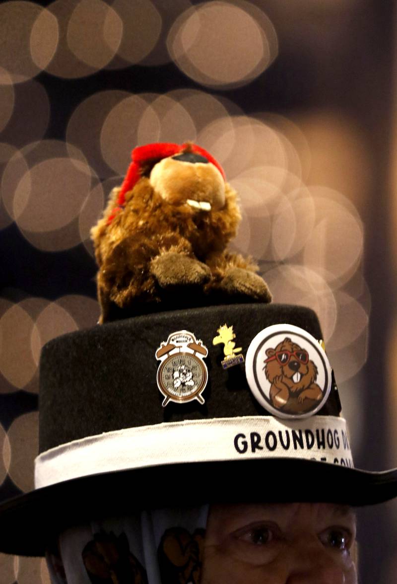 A Woodstock Willie stuffed animal on the top of a Groundhog Days Committee members top hat on Monday, Feb. 2, 2026, during the annual Groundhog Day Prognostication in the Woodstock Square.