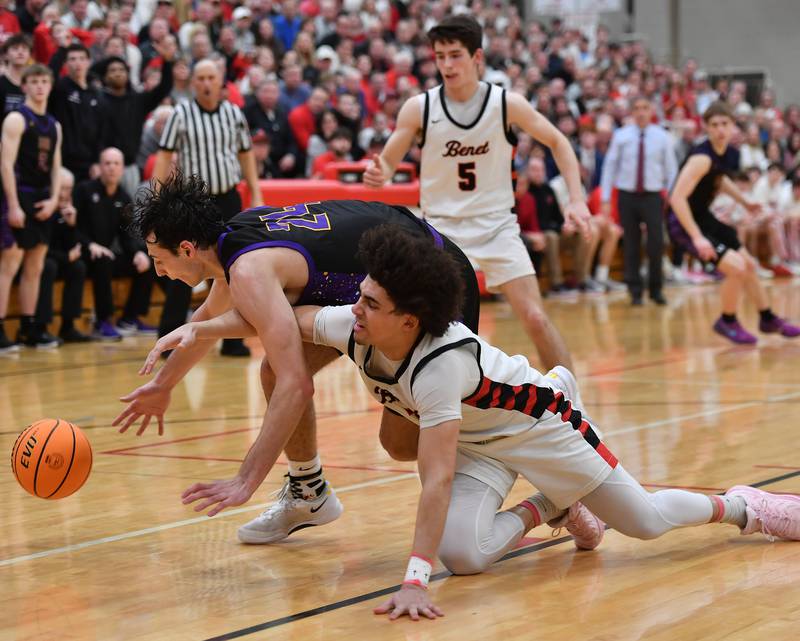 Benet’s Jayden Wright and Downers Grove North’s Aidan Akkawi (left) go after a loose ball during the Class 4A Benet Sectional championship game on March 7, 2025 at Benet Academy in Lisle.