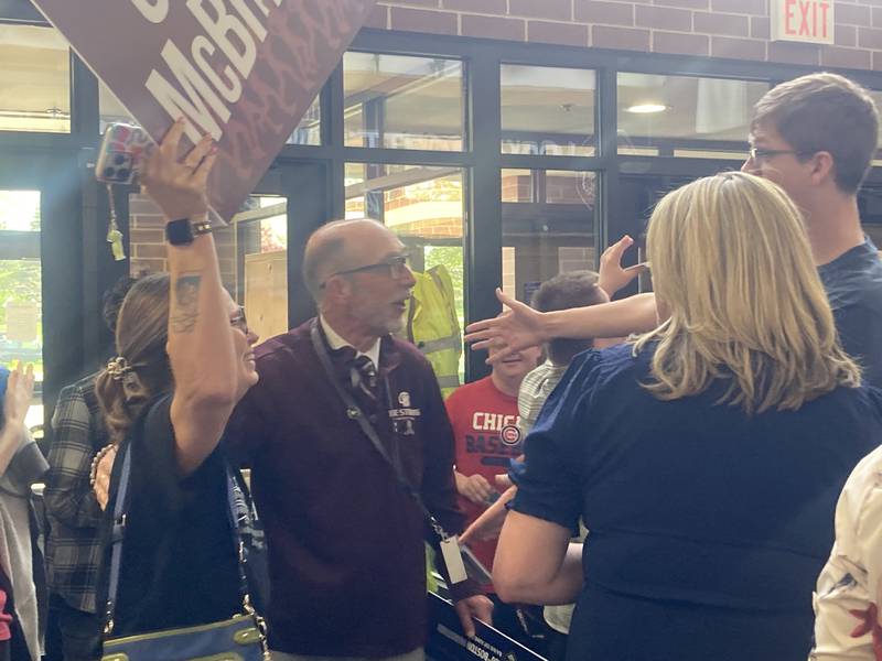 LTHS Superintendent Dr. Robert McBride greets students after walking into his surprise Boston Marathon send-off on Friday, April 17, 2026.