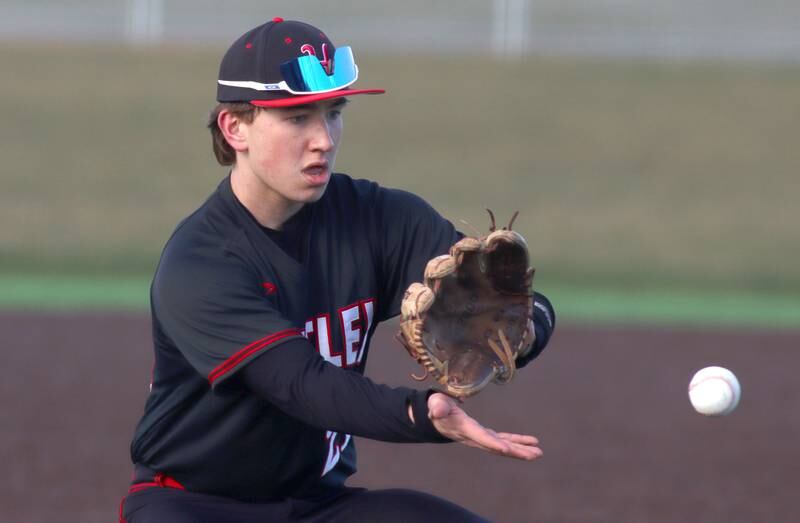 Huntley’s third baseman Marco Stawski fields a chopper in varsity baseball at McHenry Friday night.