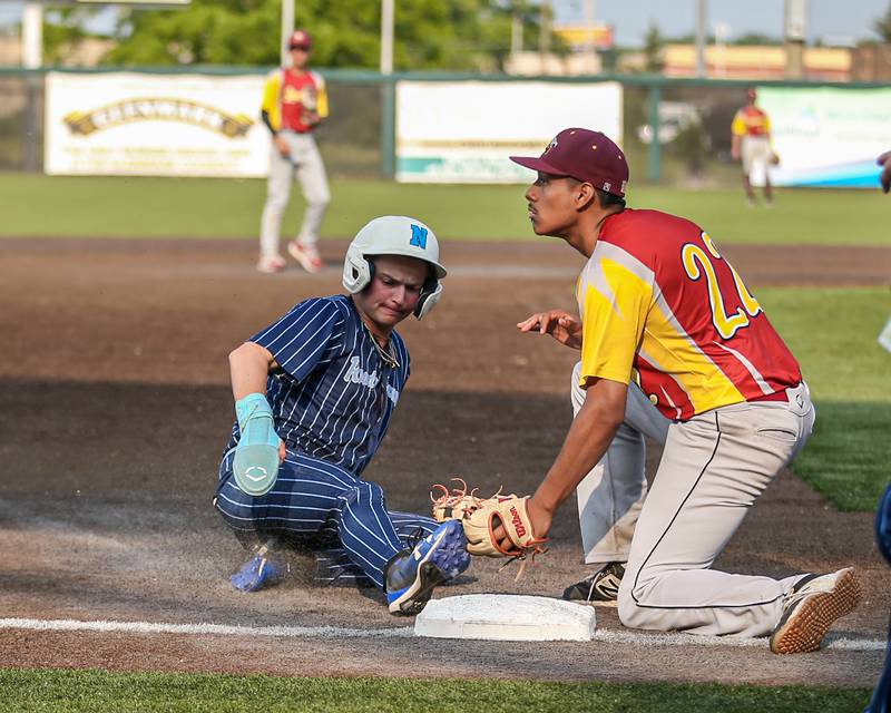 Nazareth's Luca Fiore (1) slides into third base during Class 3A Crestwood Supersectional game between Lindblom at Nazareth.  June 5, 2023.