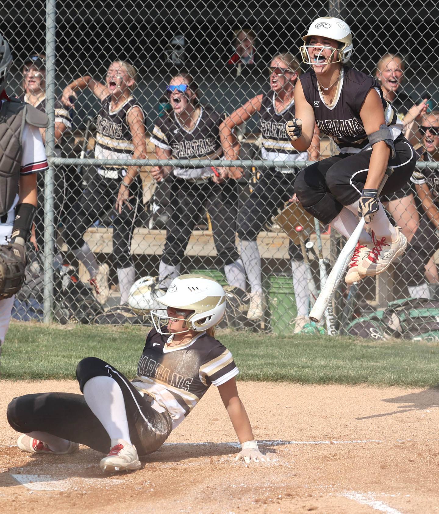 Sycamore's Kairi Lantz celebrates as Addison McLaughlin scores the first run of the game during their Class 3A supersectional game against Antioch Monday, June 5, 2023, at Kaneland High School in Maple Park.