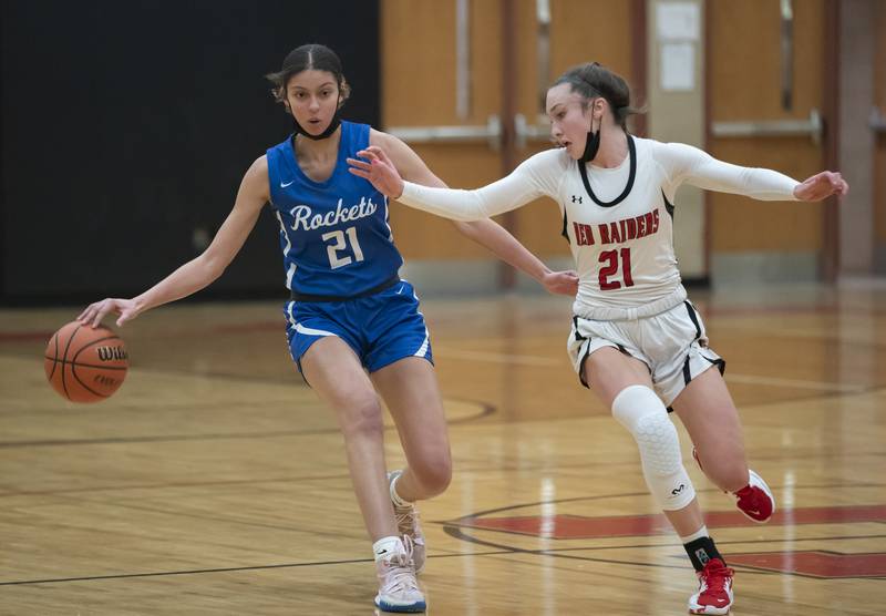 Burlington Central's Taylor Charles and Huntley's Samantha Campanelli battle for the ball mid-court during their game on Saturday, January 29, 2022 at Huntley High School. Huntley won 52-49.