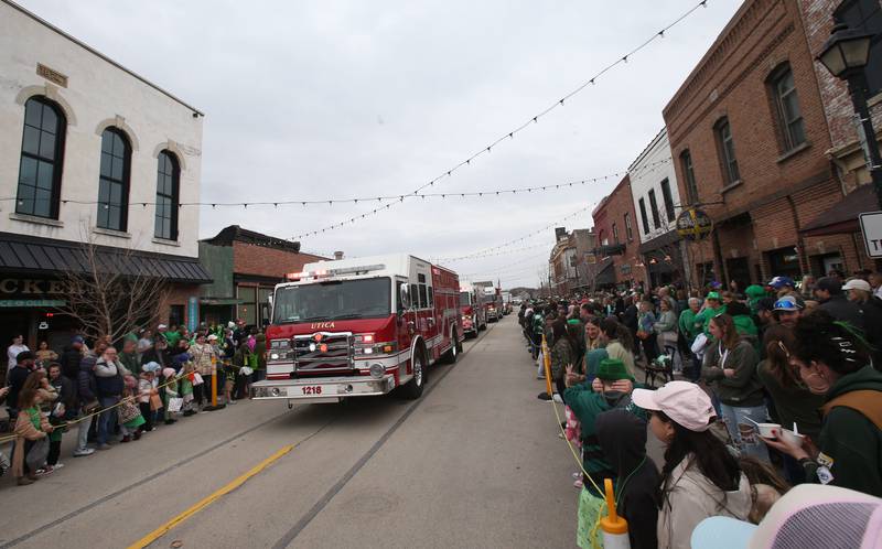 Utica fire trucks lead the way during the St. Patrick's Day parade on Saturday, March 15, 2025 downtown Utica.