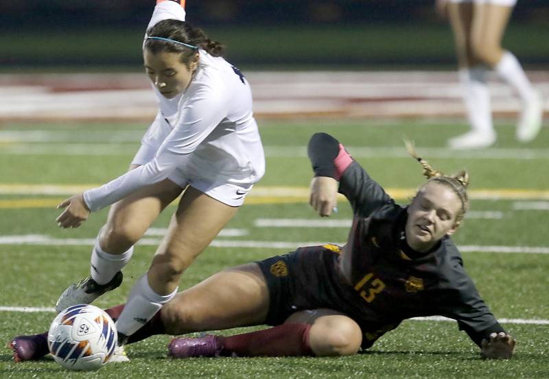 McHenry's Mara Torres and Richmond-Burton's Jordan Otto battle for the ball during a non-conference girls soccer match Thursday, March 16, 2023, at Richmond-Burton High. McHenry defeated Richmond Burton 4-0, in the first game of the season for both teams.