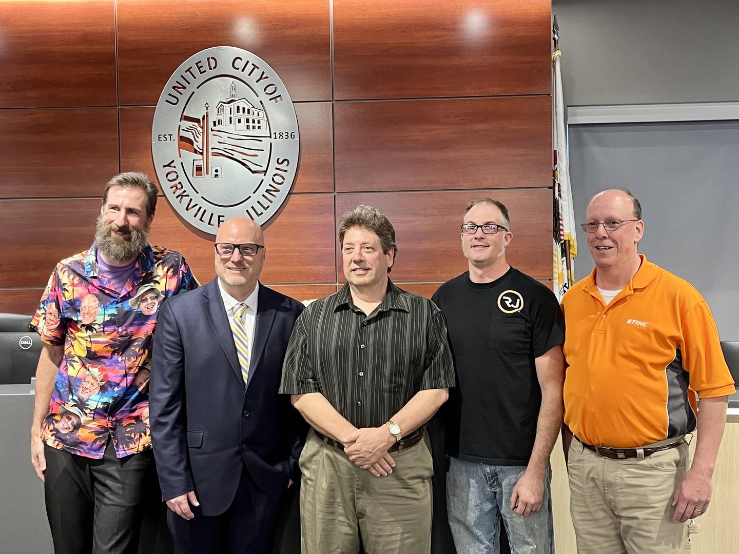 After pledging the oath of office, four alderman prepare to take the seat on the Yorkville city council. Pictured, Matt Marek, Lowell "Rusty" Hyett, Ken Kock, Arden "Joe" Plocher, and Mayor John Purcell.