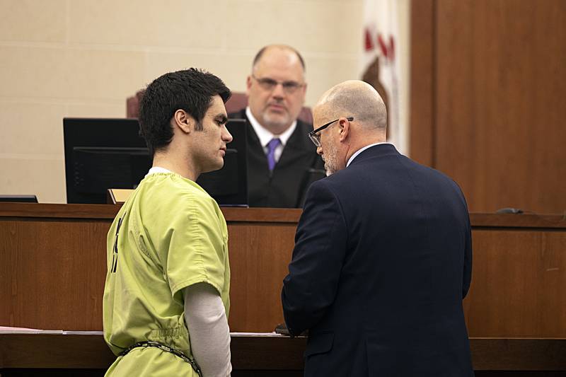 Ogle County Assistant Public Defender Michael O'Brien (right) talks to Jonathon Gounaris during a hearing in front of Judge John "Ben" Roe at the Judicial Center in Oregon on Thursday, Feb. 6, 2025.