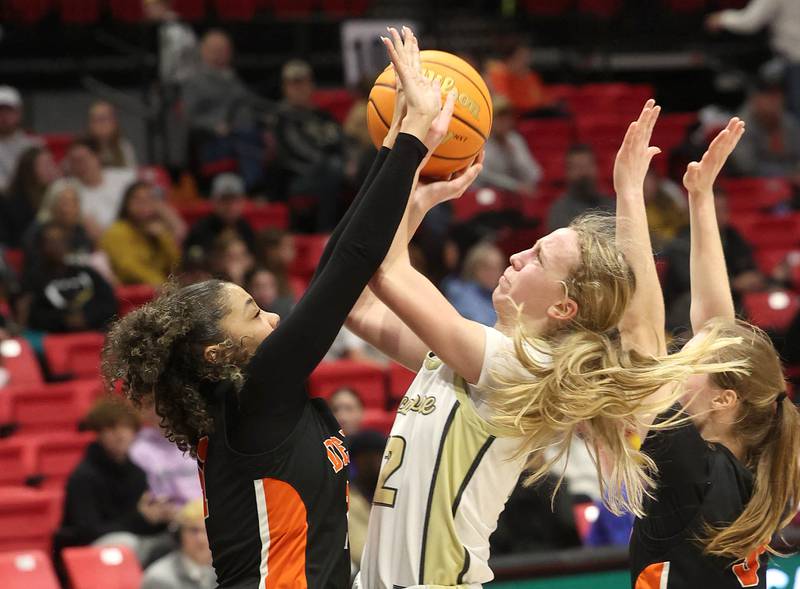 Sycamore's Sadie Lang tries to shoot over DeKalb's Alicia Johnson during their game Friday, Jan. 31, 2025, in the FNBO Challenge in the Convocation Center at Northern Illinois University in DeKalb.