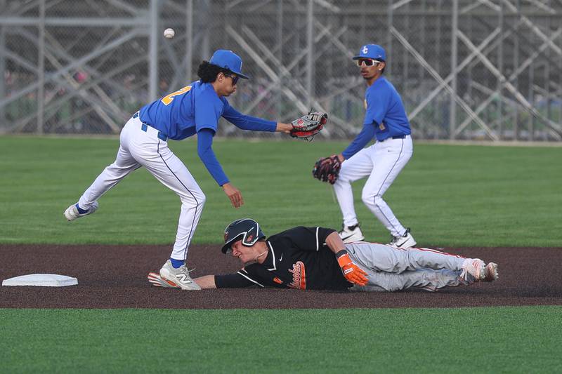 Minooka’s Gavin McReynolds steals second base against Joliet Central on Monday, April 6, 2026 in Joliet.