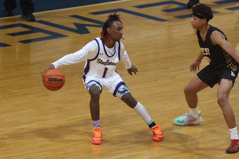 Joliet Central’s Jamarcho Holman works the ball against Joliet West.