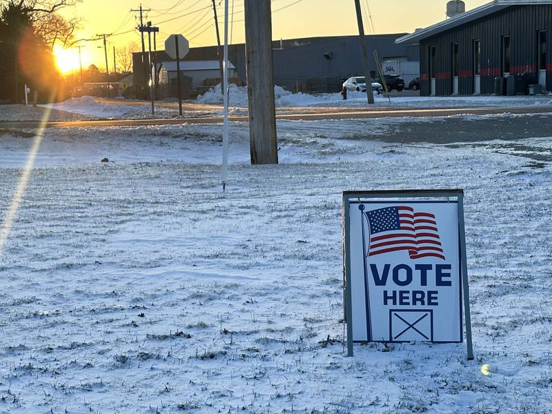 The sun rises over a "Vote Here" sign on Tuesday, March 17, 2026 at the Moose Lodge in Princeton.