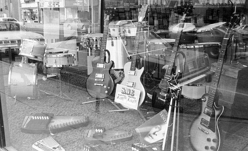 The window of Mel Elliot Music Center at 132 E. Lincoln Highway in downtown DeKalb is seen in March 1980.