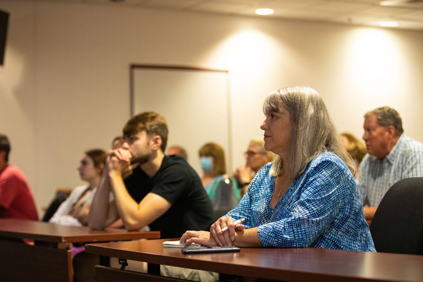 Janet Henderson of Batavia watches Lt. Williams' "Surviving an Active Shooter" presentation at the Kane County Sheriff's Office on Tuesday, July 19, 2022.