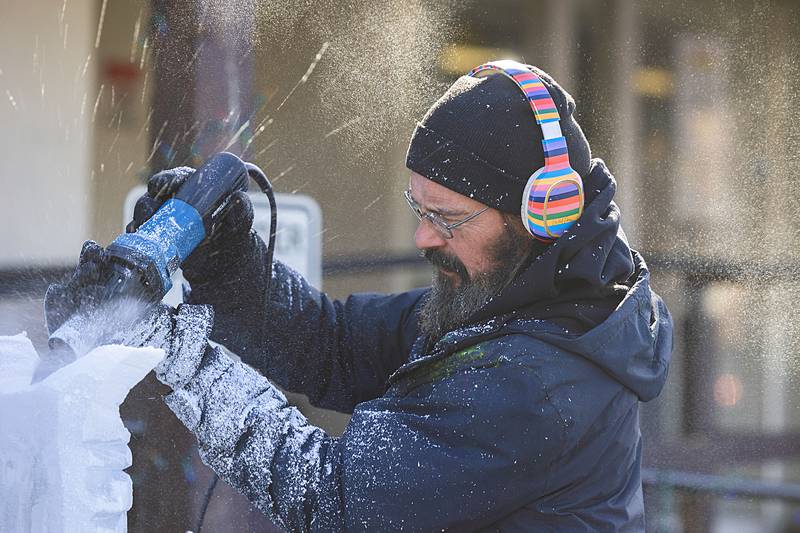 Robert Storm carves up a block of ice Saturday, Feb. 7, 2026, outside of the Rock Falls American Legion for the annual Flock to the Rock event.