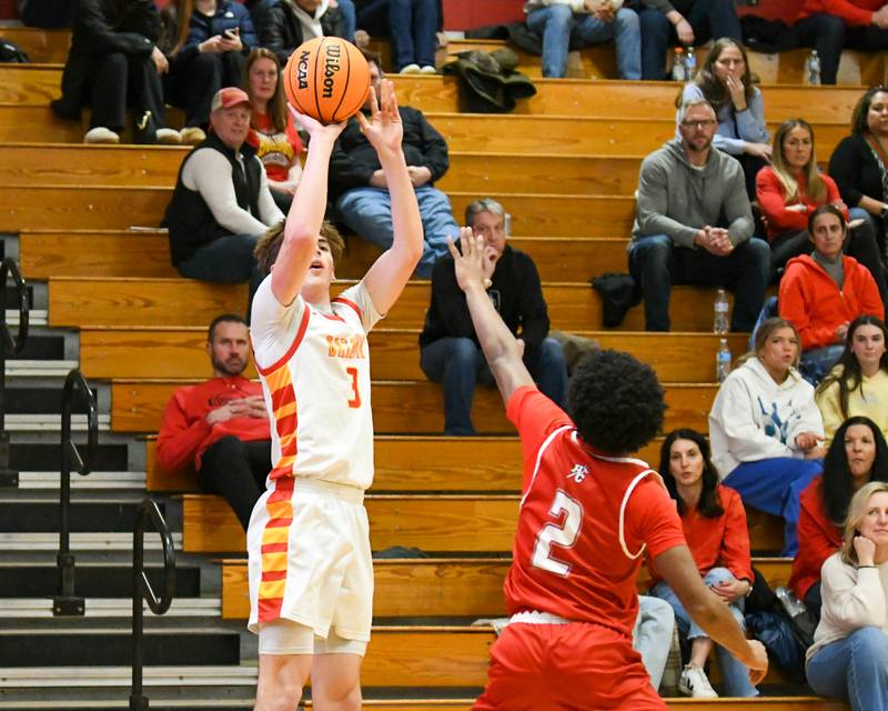 Batavia's Evan Blankenship (3) makes a three-point basket while being defended by Hinsdale Central's RJ Lewis (2) during the game on Saturday Jan. 24, 2026, held at Batavia High School.