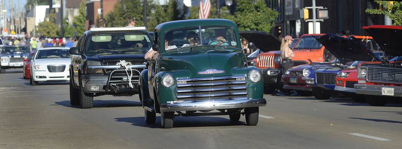 Trucks and cars , old and new participate in the cruise down Main St in Streator during the annual Cruise night.