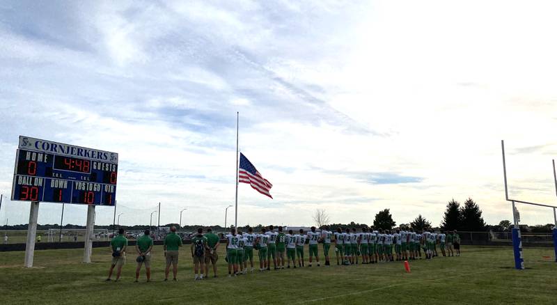 The Seneca Fighting Irish football team stands at attention for the playing of "The Star-Spangled Banner" before its game at Hoopeston Area-Armstrong on Thursday, Sept. 2, 2021.