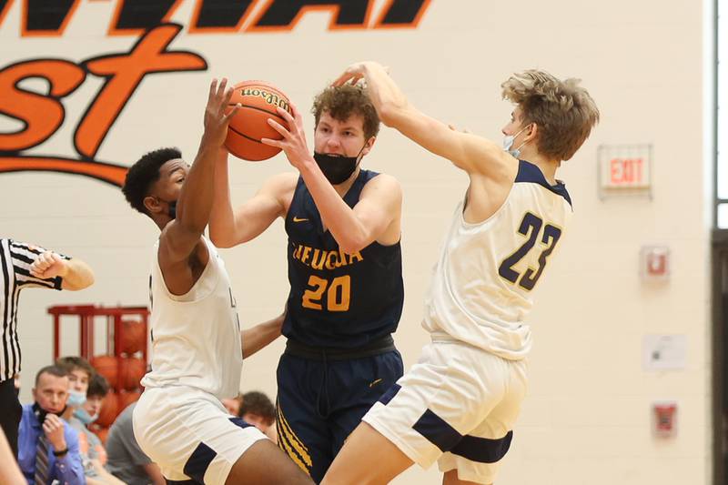 Neuqua Valley’s Erikas Gurskas fights off pressure trying to pass against Lemont in the Warrior Showdown shootout at Lincoln-Way West. Saturday, Jan. 29, 2022 in New Lenox.