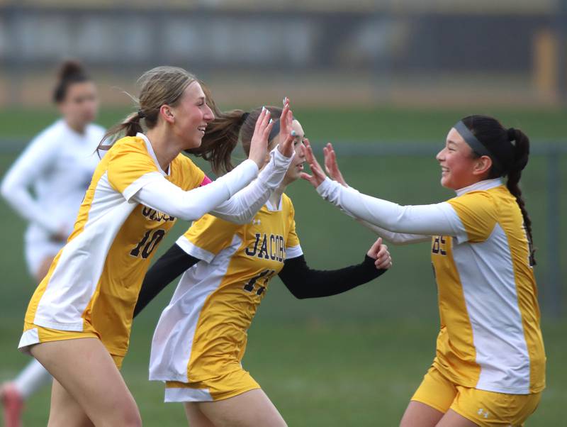 Jacobs’ Gabby Wojtarowicz, left, is greeted after a goal against Hampshire in varsity girls soccer on Thursday, April 17, 2025, at Jacobs High School in Algonquin.