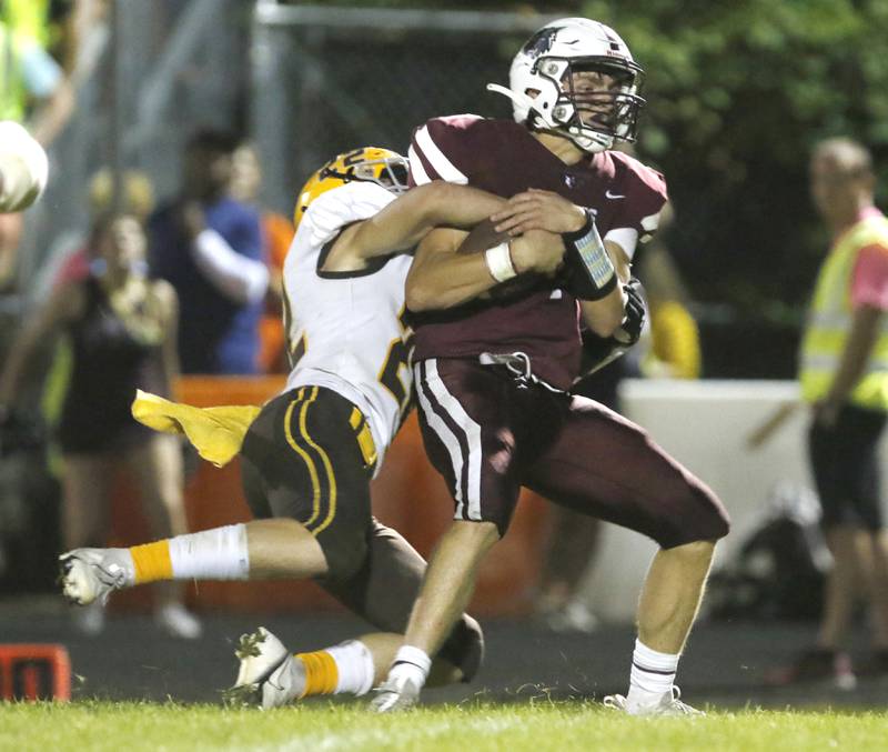 Jacobs' Ashton Niehaus tackles Prairie Ridge's Tyler Vasey during a Fox Valley Conference football game between Jacobs and Prairie Ridge Friday, Sept. 16, 2022, at Jacobs High School in Algonquin.