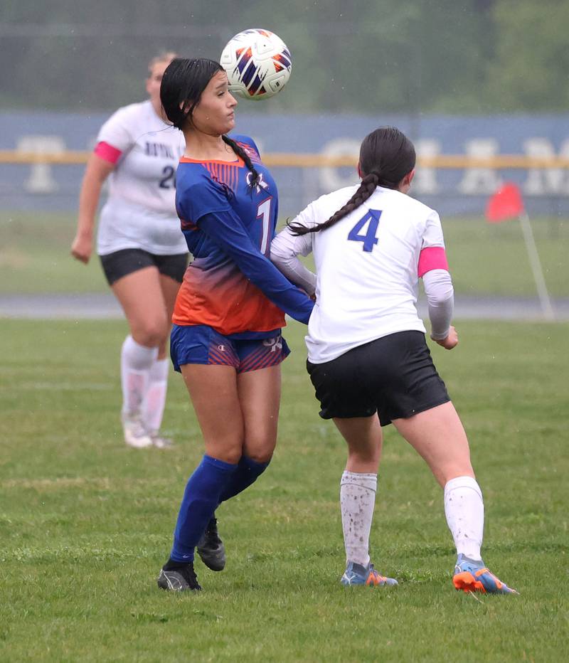 Genoa-Kingston's Jaida Modesto heads the ball away from Rockford Christian's Emily Meyers Tuesday, May 20, 2025, during their Class 2A regional final game at Rockford Christian High School.