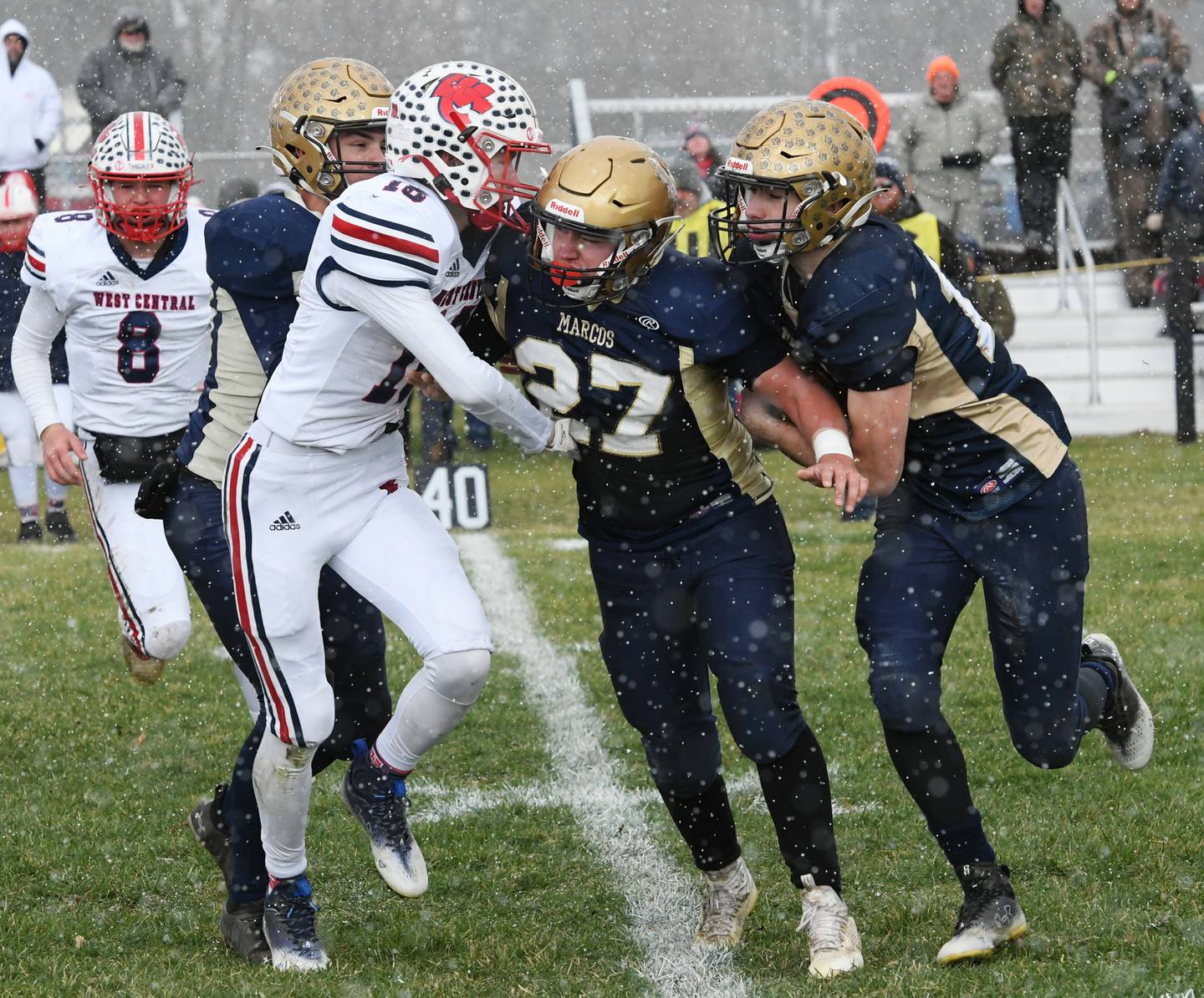 Polo's Brock Soltow follows blocker Brady Wolber during 8-man playoff action against West Central on Saturday, Nov. 12 in Polo.