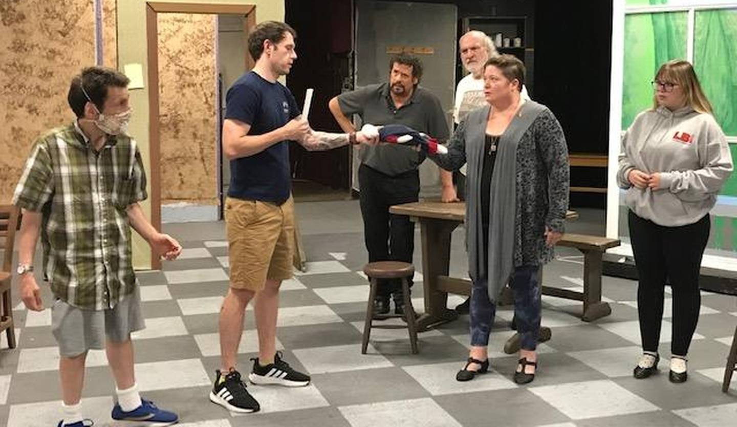 The Stage Coach Players cast of "The Crucible" rehearsing a scene