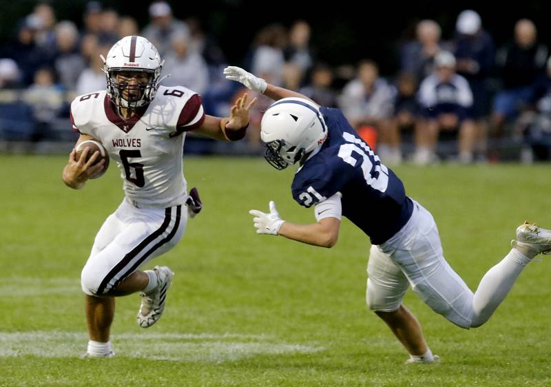 Prairie Ridge's Luke Vanderwiel avoids the tackle of Cary-Grove's Tanner Hurley during a Fox Valley Conference football game on Friday, Aug. 29, 2025, at Cary-Grove High School in Cary.