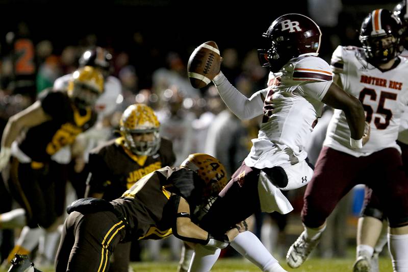 Jacobs' Luke Gormsen tackles Brother Rice's Marcus Brown] for a loss during a IHSA Class 7A first round playoff football game Friday, Oct. 28, 2022, between Jacobs and Brother Rice at Jacobs High School in Algonquin.