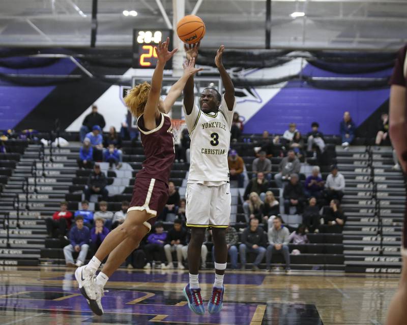 Yorkville Christian's Jayden Riley (3) shoots a jumper during their Plano Christmas Classic basketball game between Morris at Yorkville Christian Friday, Dec 26, 2025 in Plano.