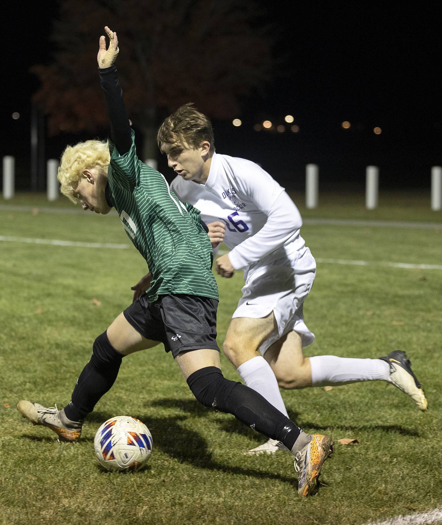 Dixon’s Cooper Fox works against Geneseo’s Cole Clifton Wednesday, Oct. 23, 2024, during the class 2A soccer regional in Geneseo.