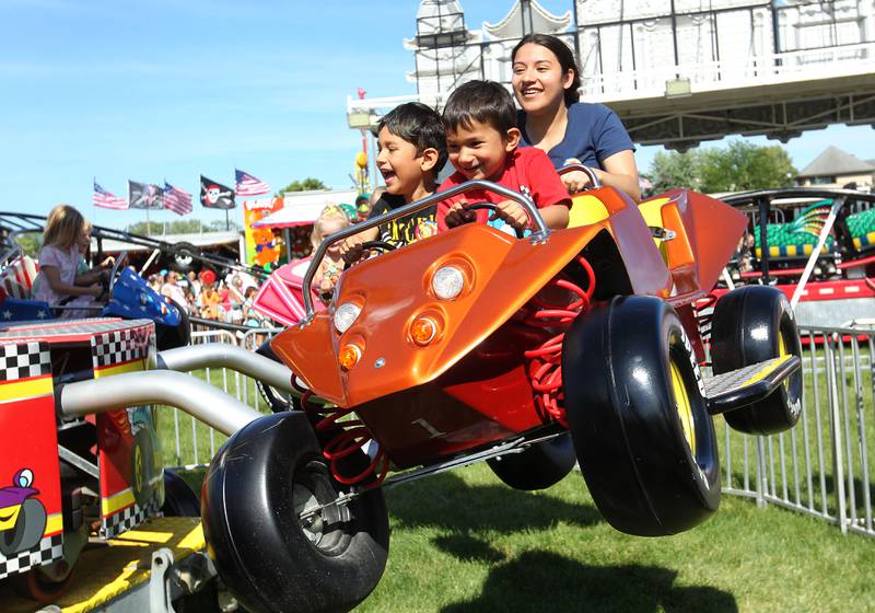 Jaz Scott, of Island Lake rides the Baja Buggy with Gabriel, 6, and Sebastian, 4, during Wauconda Fest in Wauconda.  (6/26/22)