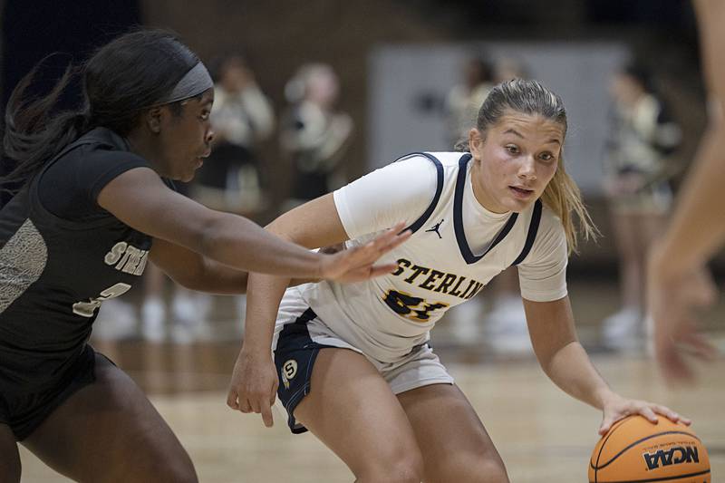 Sterling’s Jaelynn James dribbles against Galesburg’s Khloe May Thursday, Dec. 4, 2025.