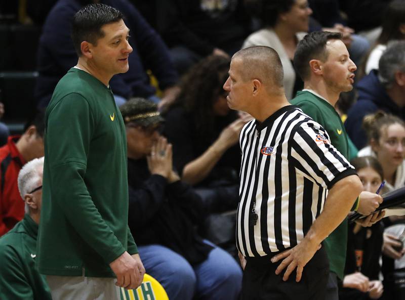 Crystal Lake South Head Coach Matt LePage talks with the referee after a call was made against his team during a Fox Valley Conference basketball game against McHenry on Friday, Jan. 31, 2025, at Crystal Lake South High School.