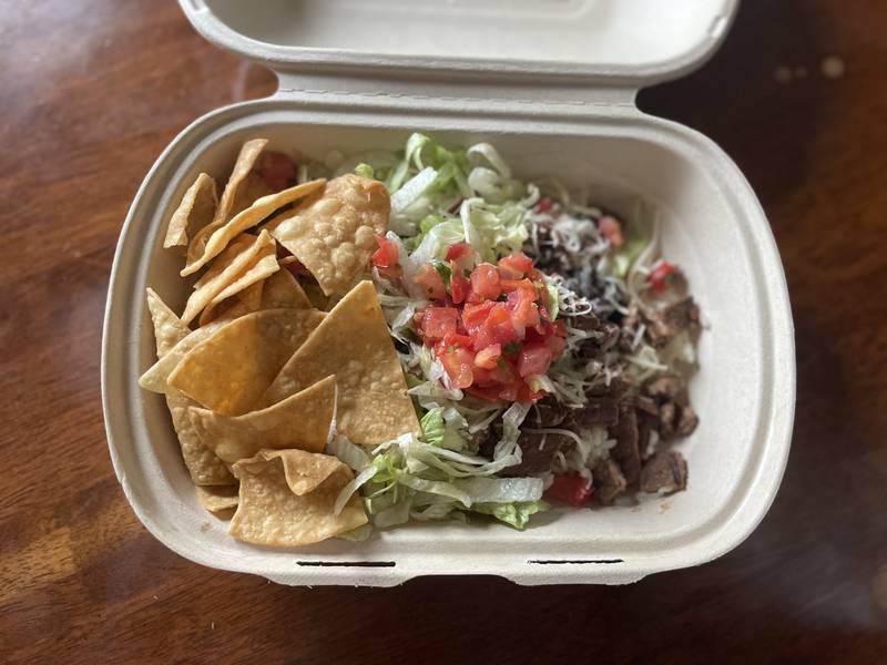 The flame-grilled Angus steak burrito bowl is a hit at the new Guzman y Gomez Mexican Kitchen in Crystal Lake.