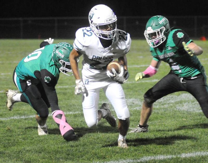 St. Bede's Jose DeLaTorre runs past Seneca's Nate Othon (10) and Nick Grant (4) at Seneca on Friday, Oct. 20, 2023.