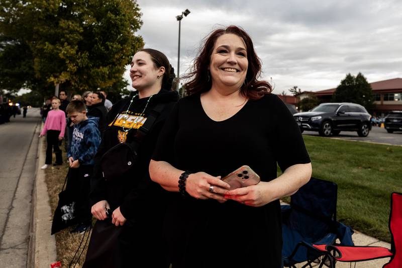 Emma and Yvonne Graf enjoy the Joliet West homecoming parade as it travels down Glenwood Ave. in Joliet on Oct. 10, 2025.
