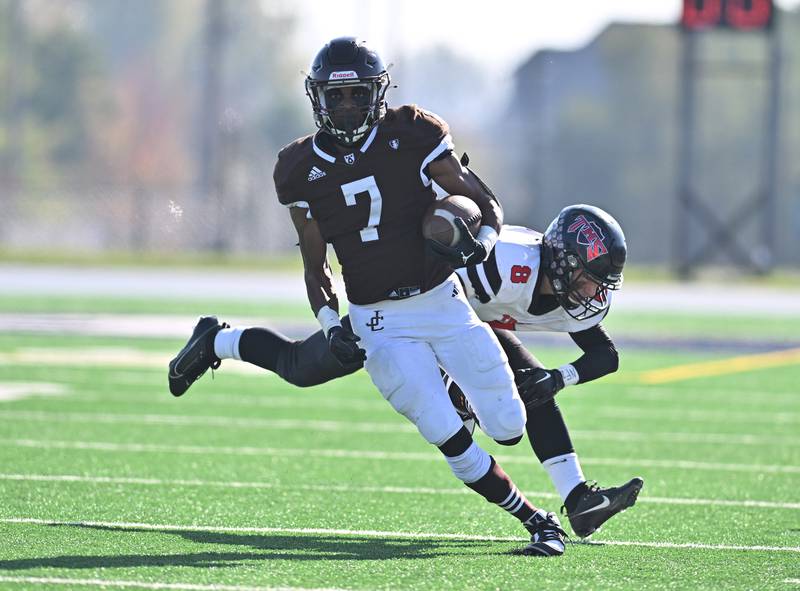 Joliet Catholic Academy's running back Hiram J. Grigsby III (7) runs for a big gain during the class 5A second round playoff game against Triad on Saturday, Nov. 04, 2023, at Joliet. (Dean Reid for Shaw Local News Network)