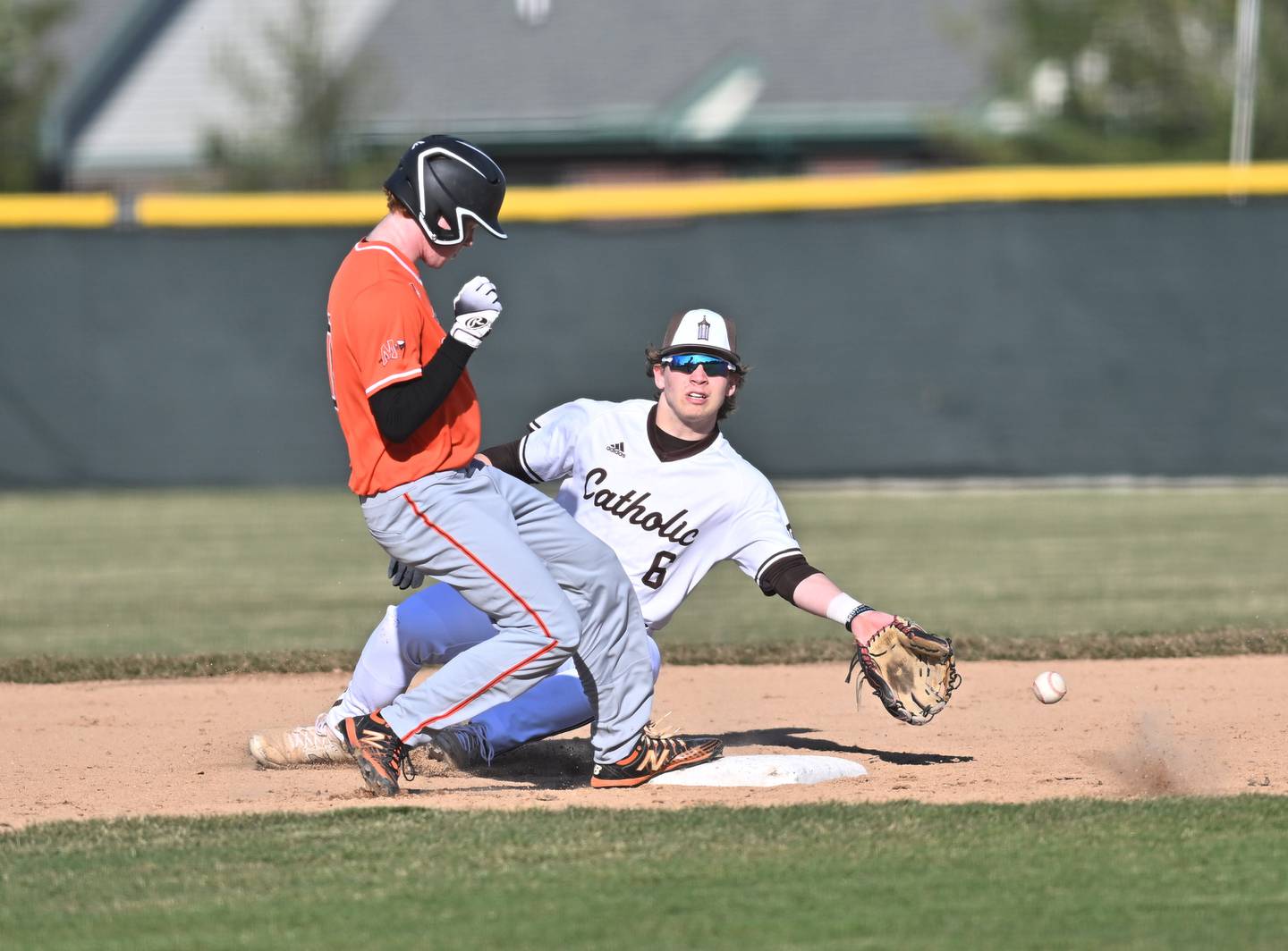 Joliet Catholic's John O'Brian attempts to make a play at second base during the non-conference game Minooka on Monday, March. 11, 2024, at Joliet.