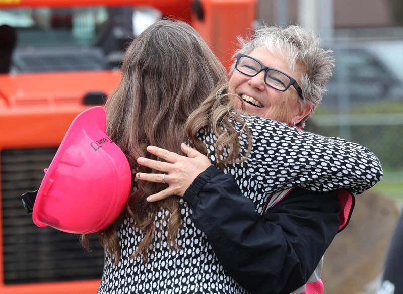 Tom & Jerry’s owner Diann Beaulieu gets a hug from a supporter Friday, May 1, 2026, during a groundbreaking ceremony to kick off the rebuilding of the restaurant at its previous location of 1670 DeKalb Avenue in Sycamore. Tom & Jerry’s was destroyed by a fire on January 31 and is currently operating at its temporary location at 265 West Peace Road in Sycamore.